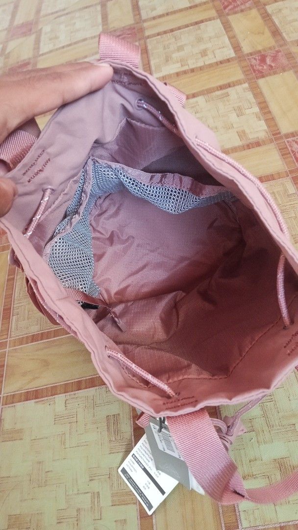 Gregory Ladybird Way Bucket Backpack (Category: Backpacks) located in General Santos City (Dadiangas). Submitted by yawords (Listing ID 1425691532, Image 3). Description: Gregory Ladybird Way Bucket backpack in a lovely pink color. It features a drawstring closure, adjustable straps, and a small internal pocket. The bag has the Gregory logo on the front. The bag has a tag attached with details about the bag..