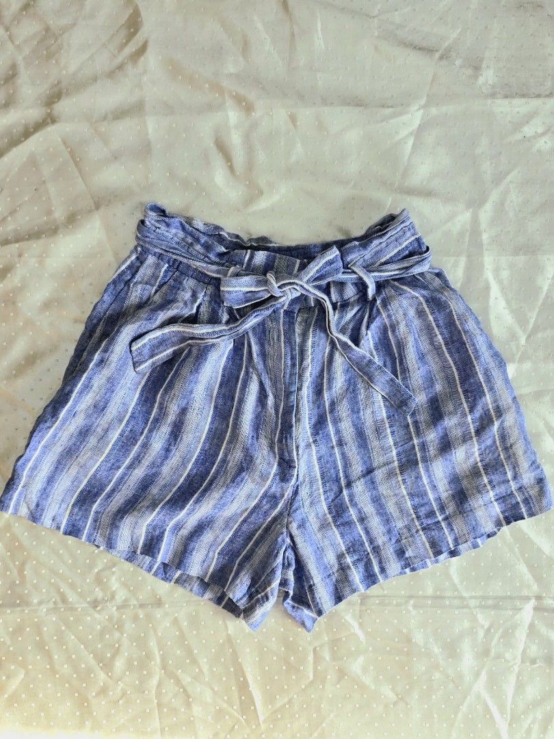H&M Striped Linen Shorts (Category: Shorts) located in Cebu City. Submitted by sixfiftyfour (Listing ID 1425744826, Image 1). Description: Stylish H&M shorts in a blue and white striped pattern. Features a high waist design with a tie-waist detail. Made from a linen blend. The shorts have a comfortable fit, perfect for casual wear. Size is indicated as EUR 34, US 4, CA 4, CN 160/64A..