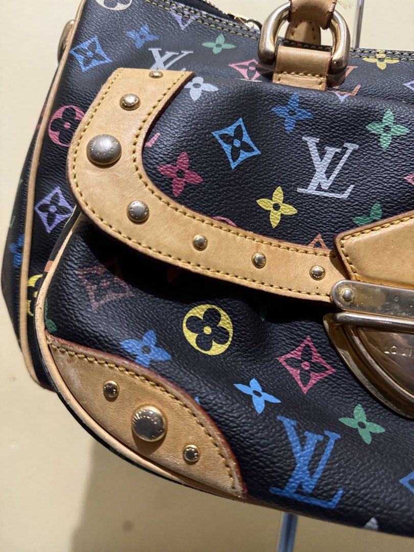LOUIS VUITTON Black Monogram Multicolore Rita Bag (Category: Luxury Bags & Wallets) located in Cagayan de Oro. Submitted by twice.but.nice.blackmarket (Listing ID 1425634102, Image 3). Description: - LOUIS VUITTON Rita Bag - Black Monogram Multicolore design - Shoulder bag style - Good overall condition - Features the iconic LV monogram pattern - Leather handles and accents - A stylish and functional bag - And Perfect color rate.