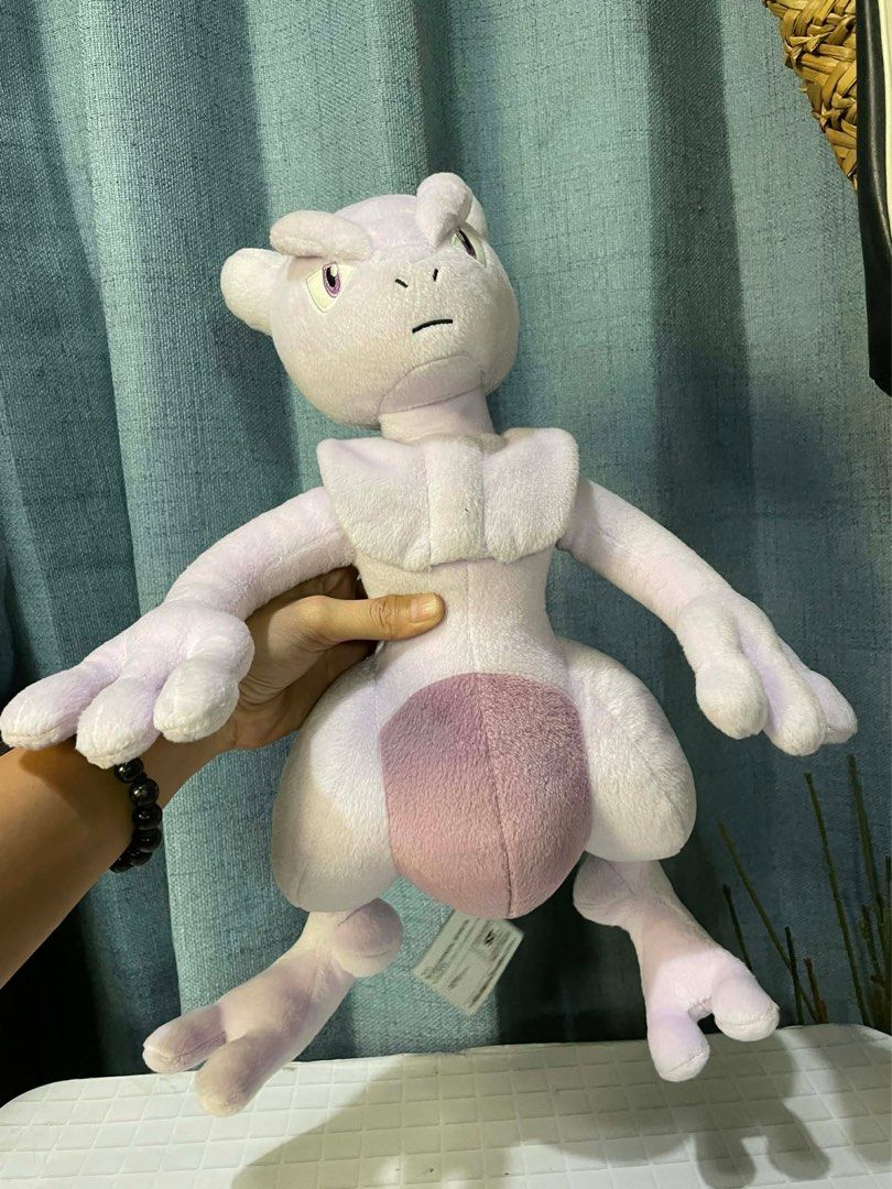 Mewtwo Plush Toy (Category: Plushies & Soft Toys) located in Manila. Submitted by thevintagebow (Listing ID 1425785906, Image 1). Description: The Ultimate Genetic Masterpiece! 🧬🔥 Own the legendary Mewtwo from the 2019 Mewtwo Strikes Back: Evolution movie. Condition: Brand New with Tags (NWT) Design: High-detail movie-accurate plush Price: ₱1,800 PHP ONLY 💸 International: ₱3,500 – ₱4,200+ (Due to high import & shipping fees) Local Hobby Shops: