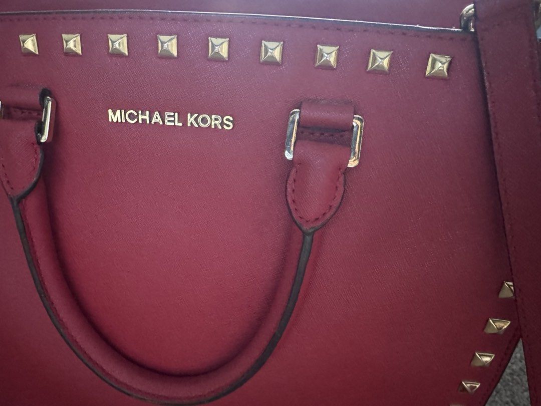 Michael Kors Selma Stud Medium Satchel Red Saffiano Leather Complete Set Authentic (Category: Luxury Bags & Wallets) located in Manila. Submitted by wisehorse.d929fd (Listing ID 1425633882, Image 3). Description: Michael Kors Selma Stud Medium Satchel Red Saffiano Leather with Gold Studs Authentic Michael Kors bag in very good condition. Structure is still firm and studs are all intact. Includes complete set: • Original Michael Kors box • Dust ba