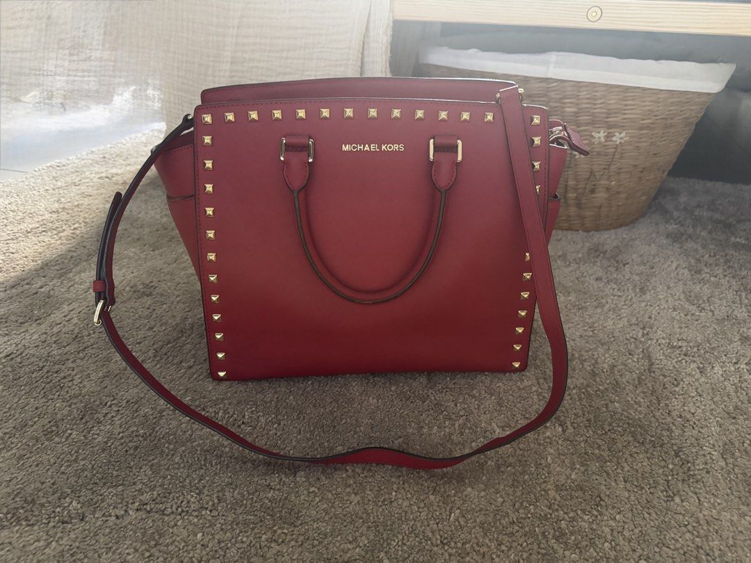 Michael Kors Selma Stud Medium Satchel Red Saffiano Leather Complete Set Authentic (Category: Luxury Bags & Wallets) located in Manila. Submitted by wisehorse.d929fd (Listing ID 1425633882, Image 2). Description: Michael Kors Selma Stud Medium Satchel Red Saffiano Leather with Gold Studs Authentic Michael Kors bag in very good condition. Structure is still firm and studs are all intact. Includes complete set: • Original Michael Kors box • Dust ba