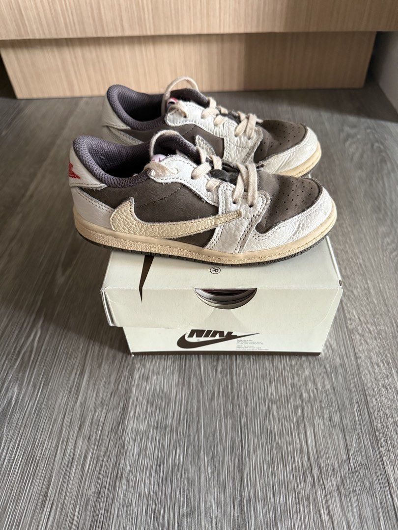 Nike Air Jordan 1 Low Travis Scott Reverse Mocha (Category: Babies & Kids Fashion) located in Quezon City. Submitted by ran.dr (Listing ID 1425642380, Image 2). Description: Travis Scott Reverse Mocha 10C 16cm 1000% Authentic Outgrown, fits 4-6 y/o First own and not a reseller 7,000.