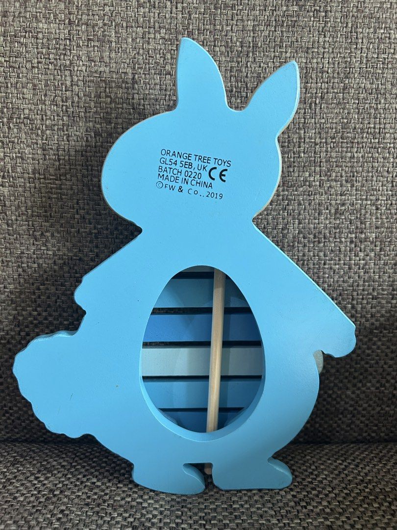Orange Tree Toys Peter Rabbit Xylophone preloved (Category: Educational & Learning Toys) located in Marikina City. Submitted by cutesypatsy (Listing ID 1425642001, Image 2). Description: Adorable xylophone features a Peter Rabbit design. It is made by Orange Tree Toys and manufactured in China. The back of the xylophone has an egg-shaped cutout. The xylophone has blue bars and comes with a red-tipped mallet. The item is from 2019..