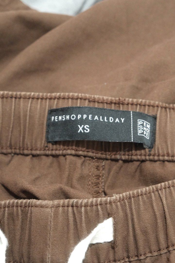 Penshoppe Brown Shorts (XS) (Category: Shorts) located in Santa Rosa. Submitted by radarr (Listing ID 1425746802, Image 3). Description: Size on tag: XS Dimensions: Waist (in): 25-27 Length (in) : 14.5 - Penshoppe Brown Shorts (XS, Unisex) - Elastic waistband and drawstring - Versatile brown color - Comfortable for everyday wear.