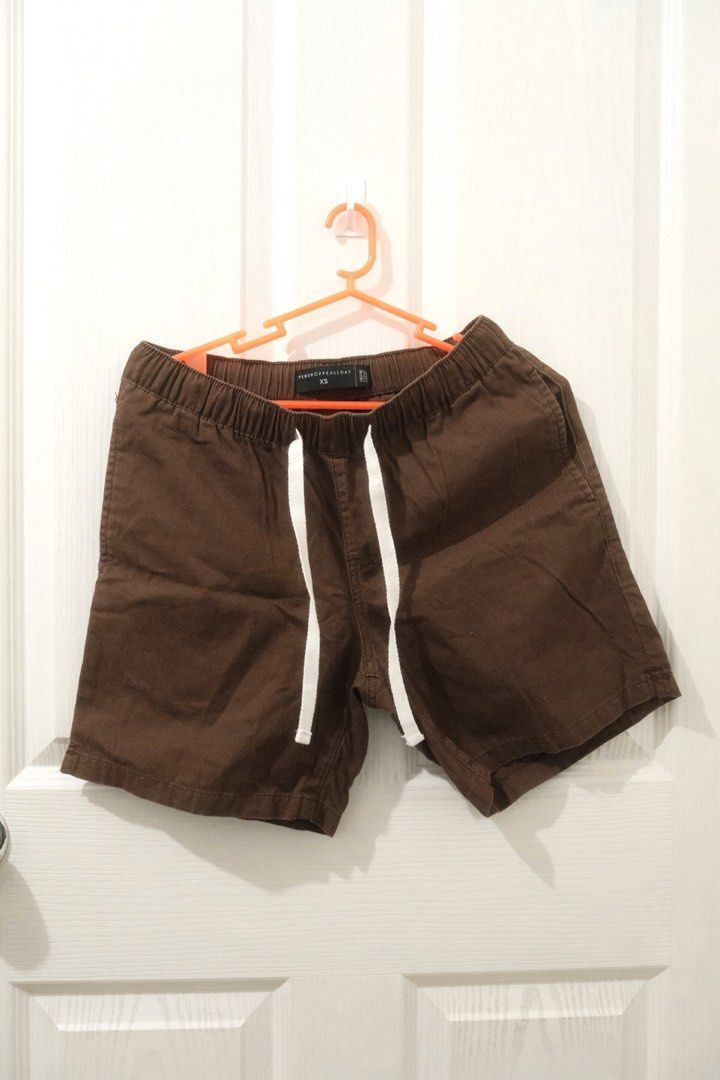Penshoppe Brown Shorts (XS) (Category: Shorts) located in Santa Rosa. Submitted by radarr (Listing ID 1425746802, Image 1). Description: Size on tag: XS Dimensions: Waist (in): 25-27 Length (in) : 14.5 - Penshoppe Brown Shorts (XS, Unisex) - Elastic waistband and drawstring - Versatile brown color - Comfortable for everyday wear.
