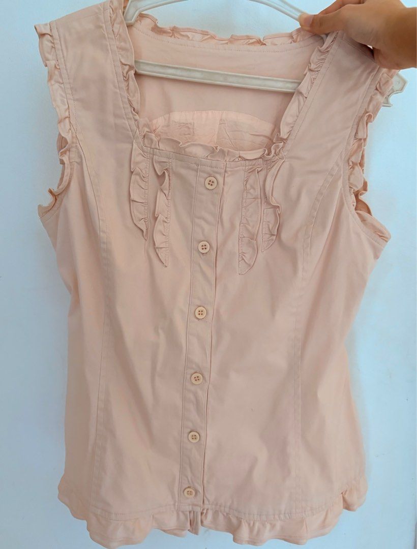 pink frilly shoujo sleeveless button up blouse (Category: Sleeveless) located in Quezon City. Submitted by legbur (Listing ID 1425675881, Image 1). Description: ‼️ NO WW size: M-L brand: N/A - 10/10 condition, no flaws - has a belt at the back to snatch the waist - material is really good quality and can pair with a lot of outfits, would keep if it were my size :< payment through gcash only! can be delivered through lalamove or j&t.