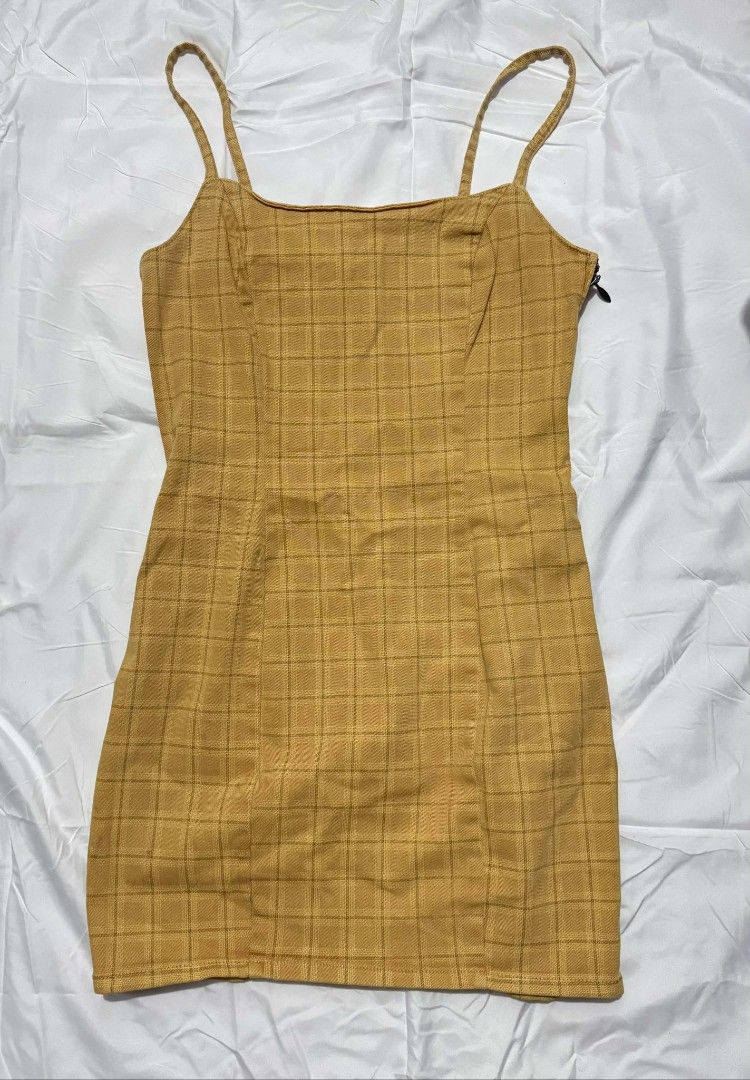 Plaid Denim Mini Yellow Dress (Category: Dresses) located in Malabon City. Submitted by WanderThingsPH (Listing ID 1425776757, Image 3). Description: Divided Yellow plaid mini dress with spaghetti straps. Features a side zipper. Fits a small size. Perfect for a casual day out or a summer gathering. The dress has a fitted silhouette..
