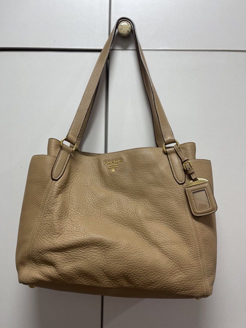 Prada Leather Tote Bag Vitello Daino (Category: Luxury Bags & Wallets) located in Manila. Submitted by apecksky (Listing ID 1425707009, Image 2). Description: Prada Vitello Daino tote bag with hardly signs of usage. Color: camel.
