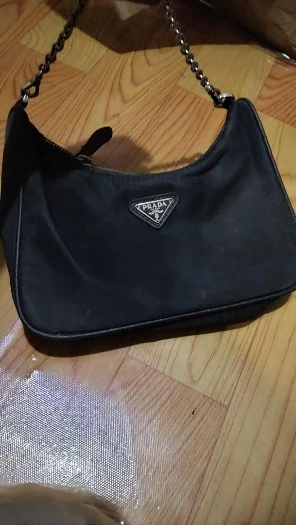 Preloved prada hobo (Category: Luxury Bags & Wallets) located in Valenzuela. Submitted by prettyjhoza_23 (Listing ID 1425761272, Image 3). Description: Hey there! Check out this awesome [prada] [mini hobo] in a sleek [Color]! The design is super stylish, perfect for everyday wear. The material feels really nice and durable. Grab it before someone else does! Used MESSAGE me.
