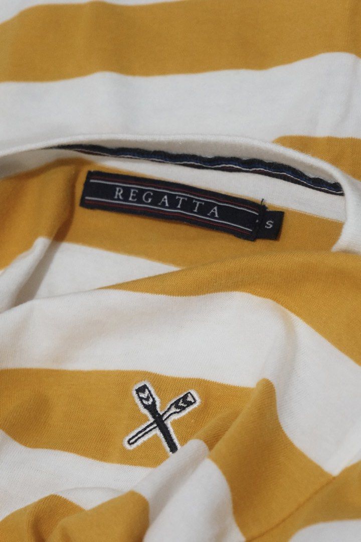 Regatta Yellow Stripped Shirt (S) (Category: Tshirts & Polo Shirts ) located in Santa Rosa. Submitted by radarr (Listing ID 1425747674, Image 3). Description: Selling one of my favorite shirts. WW last pic :) Size on tag: S Dimensions: Length (in): 24 Width (in): 19 Shoulders (in): 17 - Regatta Yellow Striped Shirt (Size S) - Features a classic striped design - Comfortable and stylish - Perfect for casual wear.