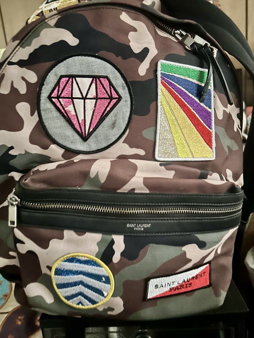 Saint laurent camouflage multi patch backpack (Category: Luxury Bags & Wallets) located in Quezon City. Submitted by asiaco (Listing ID 1425786301, Image 1). Description: Authentic with code saint laurent bp in good condition. .