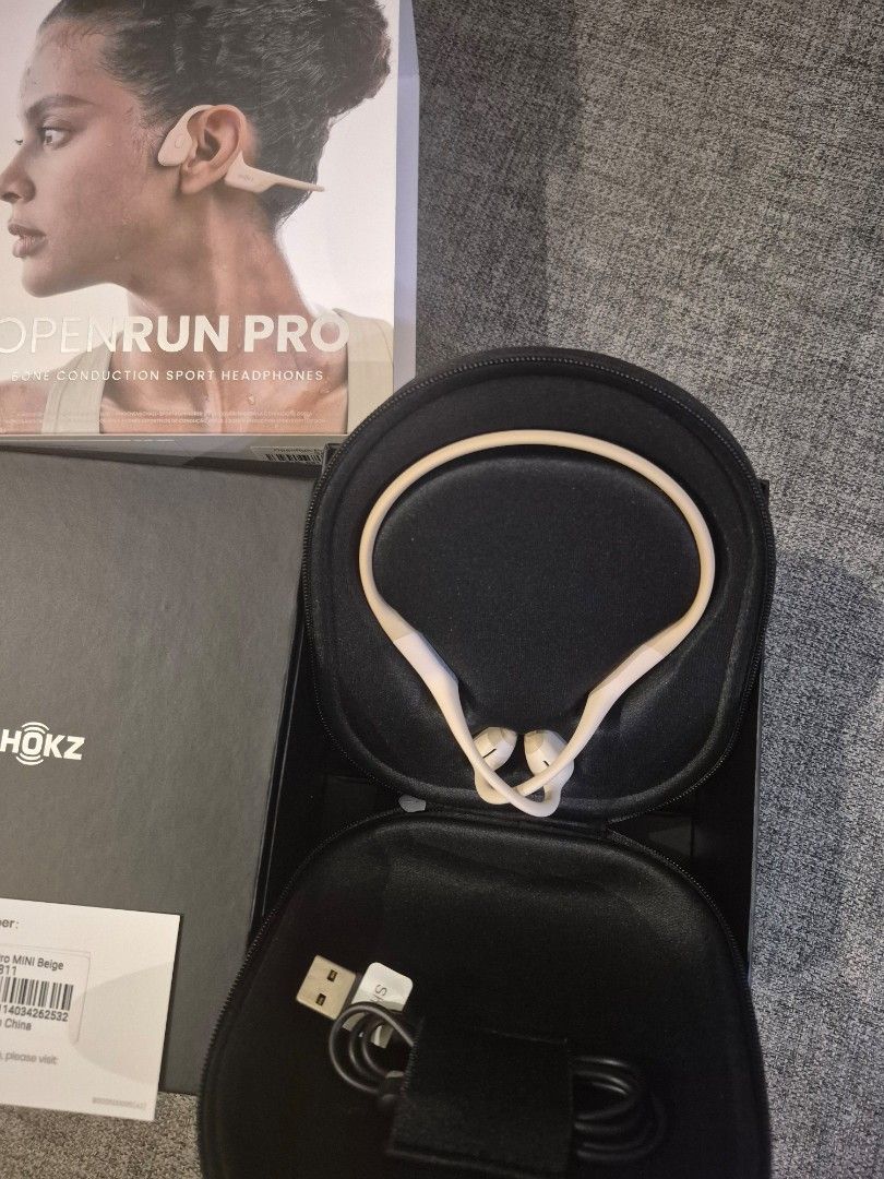 Shokz .OpenRun Pro Mini Bone Conduction Headphones (Category: Headphones & Headsets) located in Davao. Submitted by marthascloset (Listing ID 1425816012, Image 2). Description: Shokz OpenRun Pro Mini bone conduction headphones. Includes the headphones, a carrying case, a charging cable, the original box, and documentation. The headphones are white and black. The box indicates it is the Mini version. The model is OpenRun Pro..