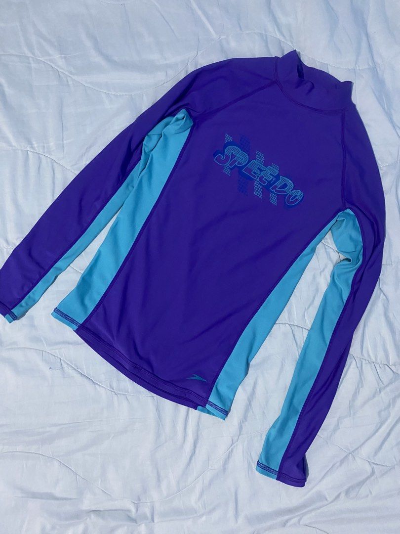 Speedo Long Sleeve Rash Guard Size 14 (Category: Rash guard) located in Makati City. Submitted by eunaj (Listing ID 1425768239, Image 1). Description: Speedo long sleeve rash guard in navy blue and peach. Features a high neck and Speedo logo on the front. Size 14. Made of 85% polyester and 15% spandex. SPF 50. Fit to S-L size ✔️ Used twice only ✔️ .