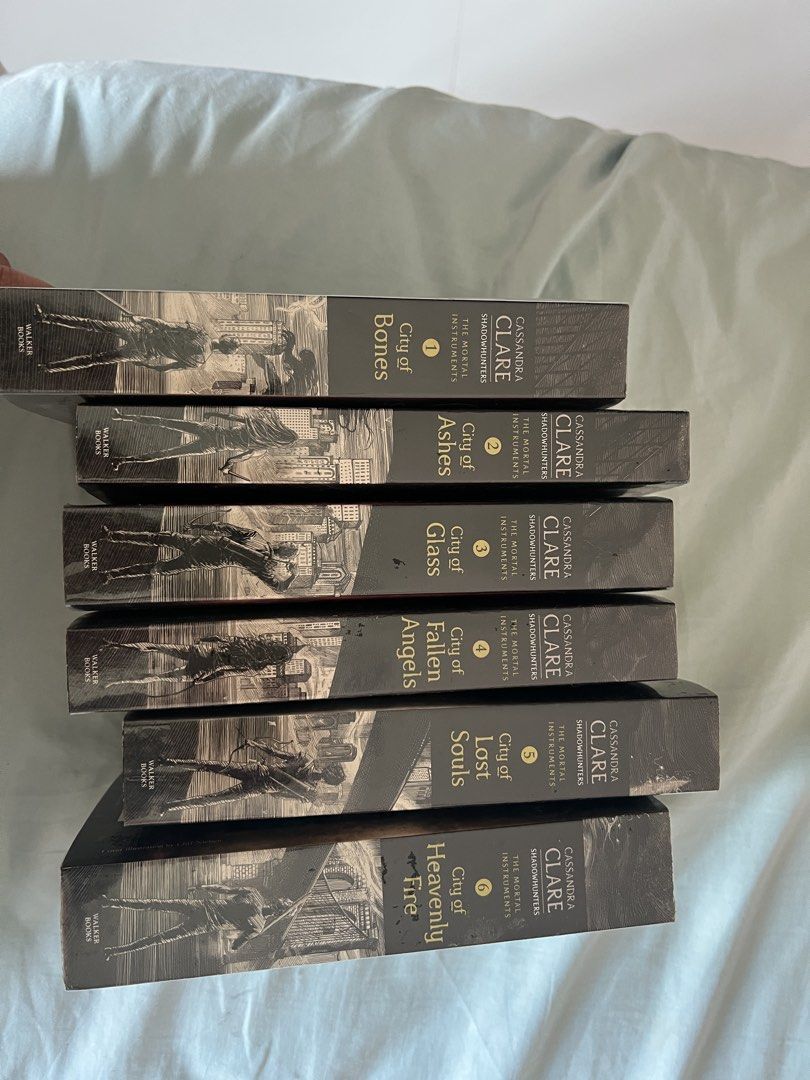 The Mortal Instruments Series by Cassandra Clare (Category: Storybooks) located in San Jose. Submitted by jyraba (Listing ID 1425649812, Image 2). Description: No box. Never read but opened. Stored only. All books with plastic cover. With yellowing of pages. No creases. Paperback. To be sold as SET. AUTHENTIC. Payment first..