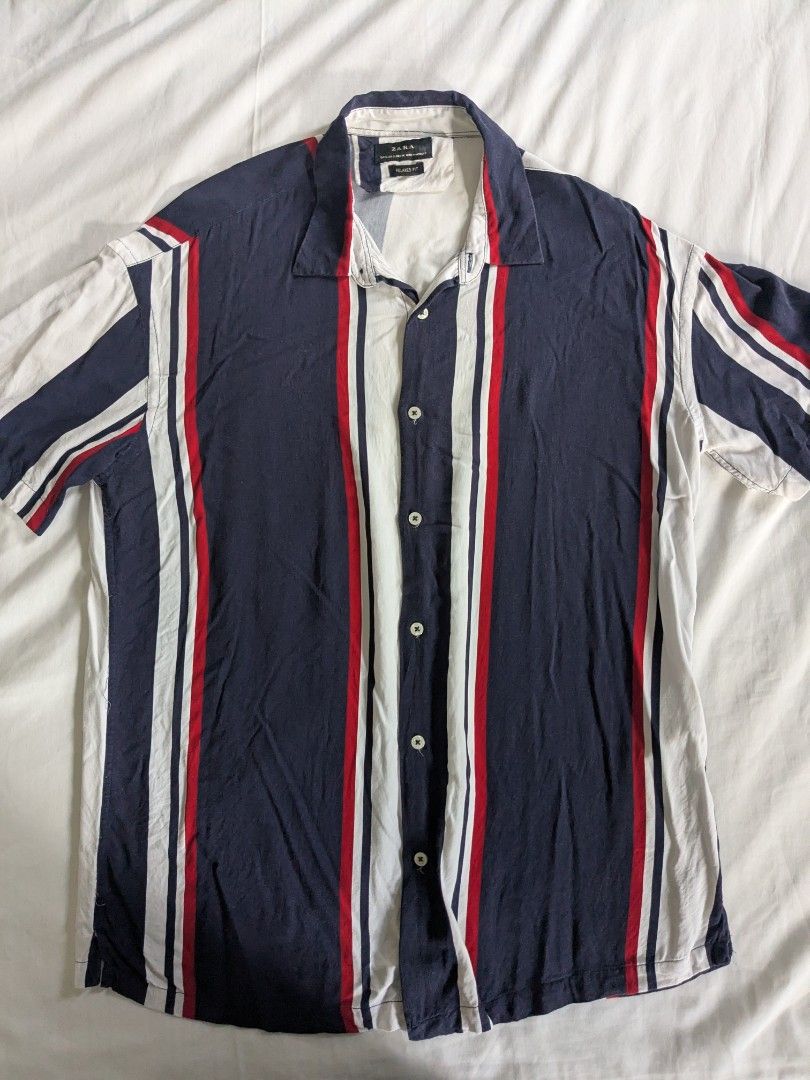 Zara Button Up Striped Polo Shirt - Small (Category: Tshirts & Polo Shirts ) located in Quezon City. Submitted by frankmountain (Listing ID 1425789423, Image 1). Description: - Zara Button-Up Polo Shirt - Size: Small - Striped design (navy, white, red) - Relaxed fit - Perfect Condition. No issues - Made in Morocco.