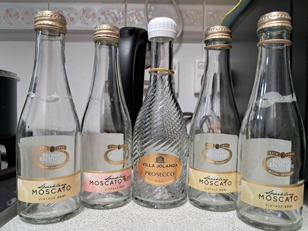 Assorted Empty Bottles (Category: Water Bottles & Tumblers) located in Singapore. Submitted by freebutterfly (Listing ID 1425934934, Image 1). Description: Collection of various empty bottles, perfect for crafts or display. Includes Moet Mini, Brown Brothers Moscato, Go Go Cocktail Co, and other decorative bottles. All bottles are empty and clean. Great for upcycling projects or adding a touch of elegance to your home decor. The size of the small