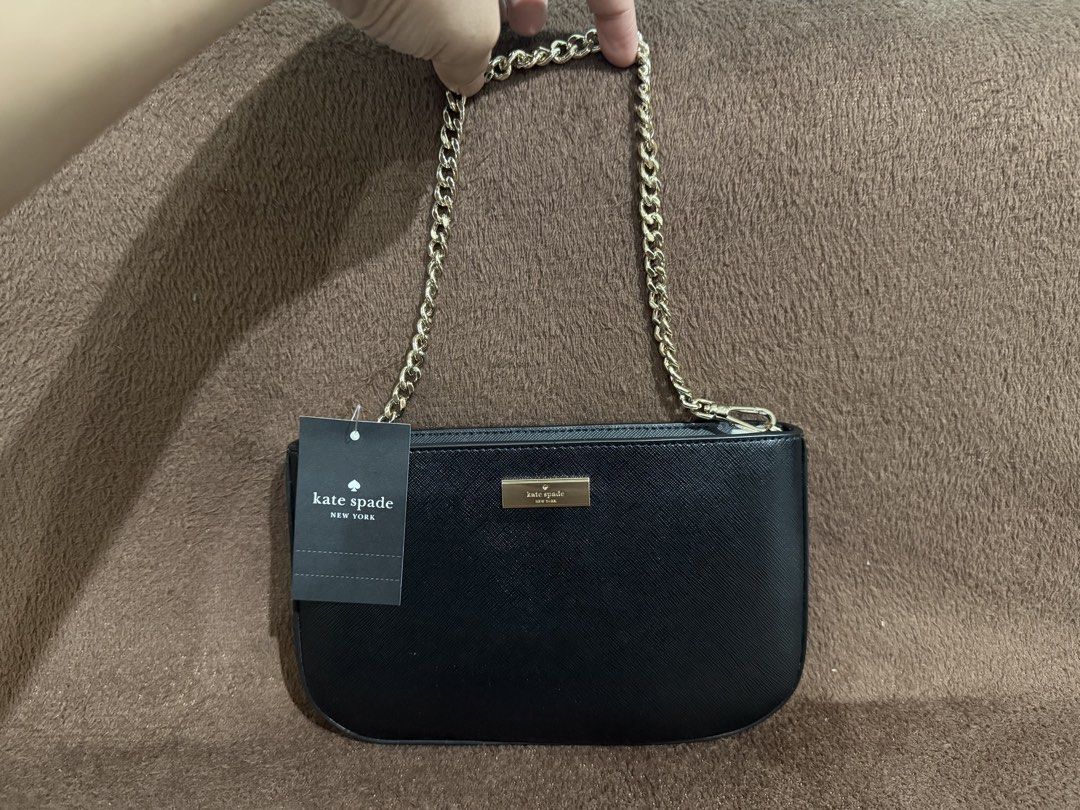 Authentic Kate Spade Kenzie Lilly Pochette (Category: Shoulder Bags) located in Quezon City. Submitted by andanel16 (Listing ID 1425927887, Image 2). Description: Authentic Kate Spade Kenzie Lilly Pochette Condition: Brand New Price: ₱ 5,000 • Elegant and versatile • Perfect for everyday errands or casual outings • Fits phone, cards, cash, and small essentials 100% Original From US If sure buyer po, I can send actual photos + packing video for tr