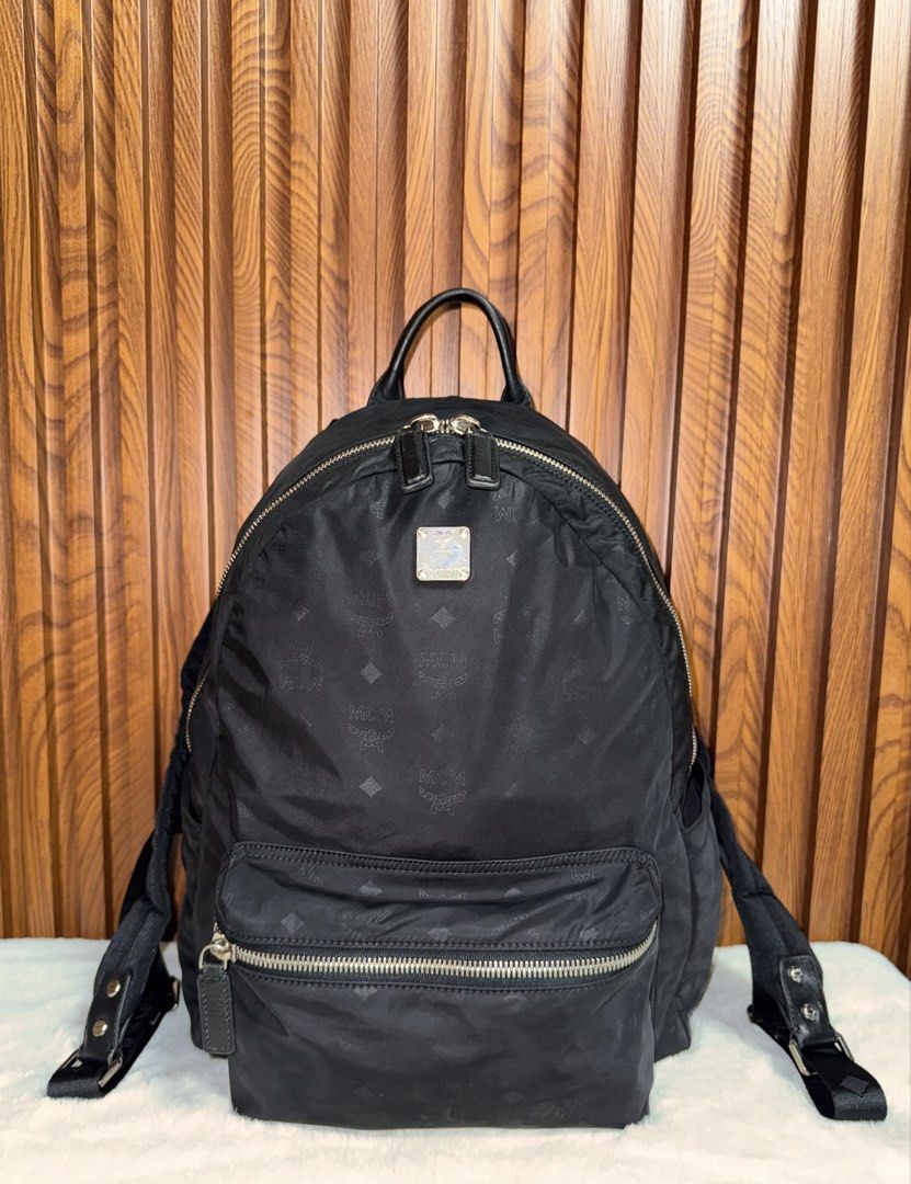 Authentic MCM nylon/leather monogram Backpack (Category: Luxury Bags & Wallets) located in Subic. Submitted by luxshoppe88 (Listing ID 1425888859, Image 1). Description: Hey there! Check out this awesome MCM nylon monogram backpack in a sleek black color. The design is super stylish, perfect for everyday wear. The material feels really nice and durable. Grab it before someone else does! Still in excellent used condition. Very nice bag actual. Spa