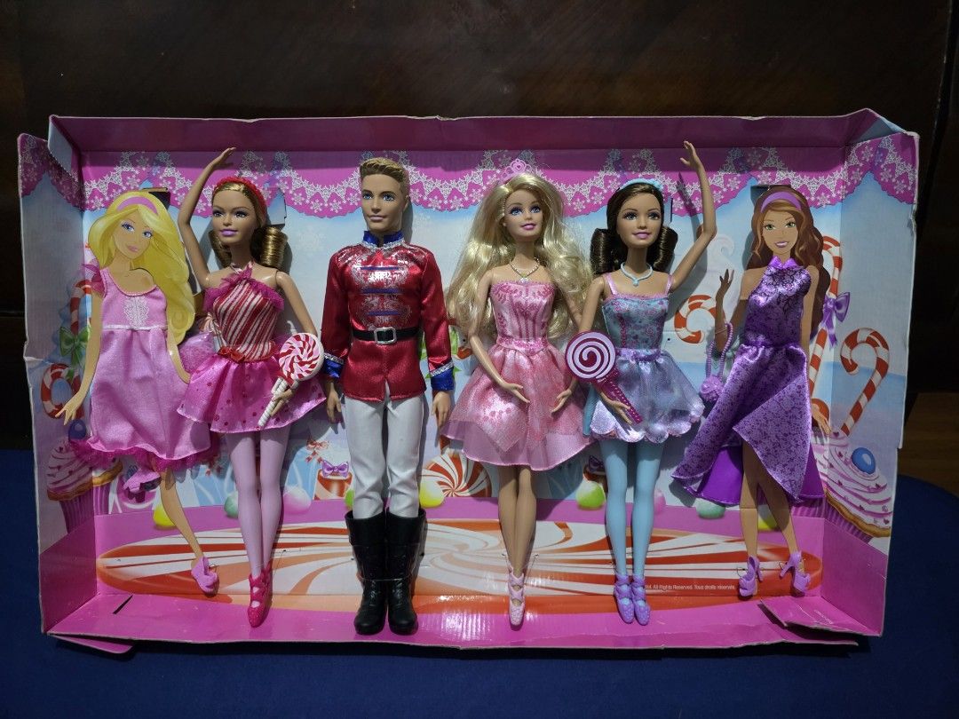 Barbie in the Nutcracker 4-Doll Holiday Gift Set (Category: Kids Toys) located in Pasig City. Submitted by temerity_16 (Listing ID 1425947448, Image 3). Description: NRFB 2014 Barbie in the Nutcracker 4-Doll Holiday Gift Set Doll heads are still attached to the cardboard Complete Accesories Includes two extra dresses🥻👗 1 bag👜 2 extra pair of shoes 👡👡🥿🥿 2 lollipops 🍭 🍭 NRFB.