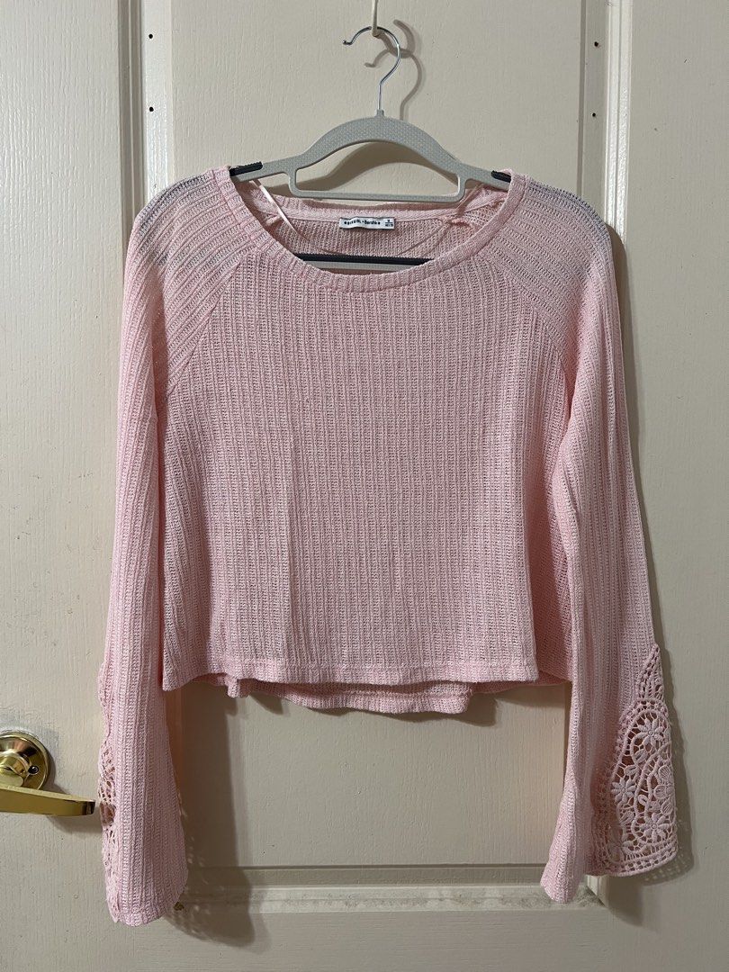 Bershka Pink Longsleeves Top (Category: Longsleeves) located in Silang. Submitted by _superjea (Listing ID 1425855461, Image 1). Description: - Pink crop top from Bershka - Features a round neck and long sleeves with lace detailing on the cuffs - The top has a textured knit fabric.
