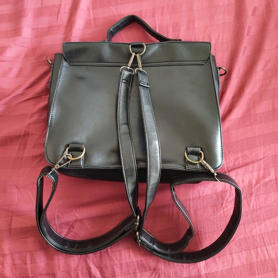 Black Satchel Bag Convertible to Backpack with Adjustable Straps (Category: Cross-body Bags) located in Quezon City. Submitted by ahcodacrem (Listing ID 1426003963, Image 2). Description: RFS: Decluttering Has adjustable straps, convertible to backpack Has minor issues like stitching (see pic) 30x24 cm.