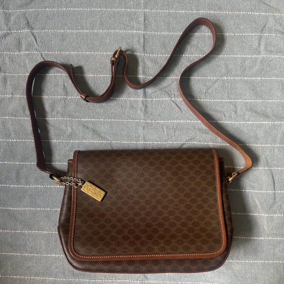 Celine Macadam Shoulder Bag (Category: Luxury Bags & Wallets) located in Mandaluyong City. Submitted by marceditems (Listing ID 1425823385, Image 1). Description: Authentic Celine shoulder bag in brown. Features the iconic Macadam pattern. Includes a detachable shoulder strap and a gold-tone metal chain with a Celine tag. The interior has multiple compartments and a zip pocket. Made in Italy. Major call out is the joint of the straps. .