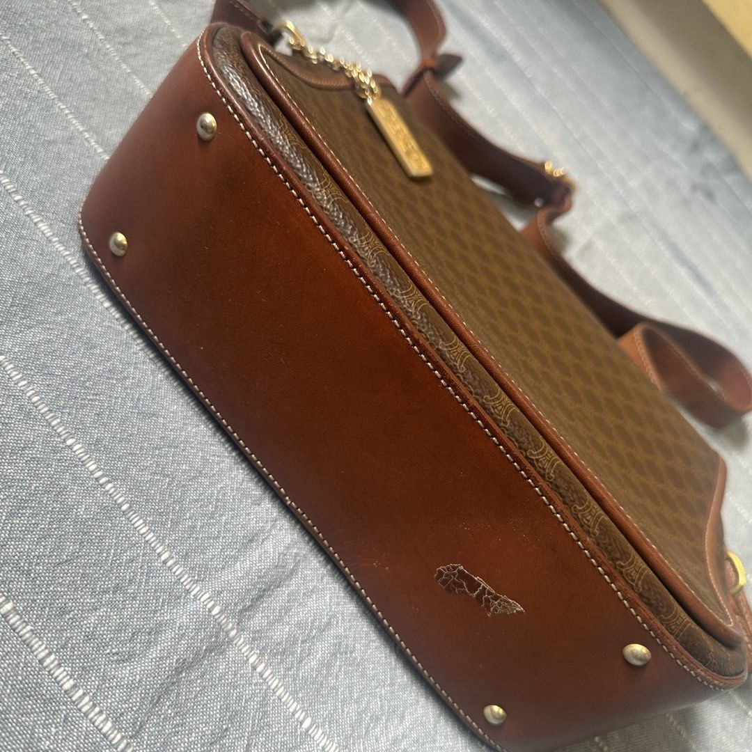 Celine Macadam Shoulder Bag (Category: Luxury Bags & Wallets) located in Mandaluyong City. Submitted by marceditems (Listing ID 1425823385, Image 3). Description: Authentic Celine shoulder bag in brown. Features the iconic Macadam pattern. Includes a detachable shoulder strap and a gold-tone metal chain with a Celine tag. The interior has multiple compartments and a zip pocket. Made in Italy. Major call out is the joint of the straps. .