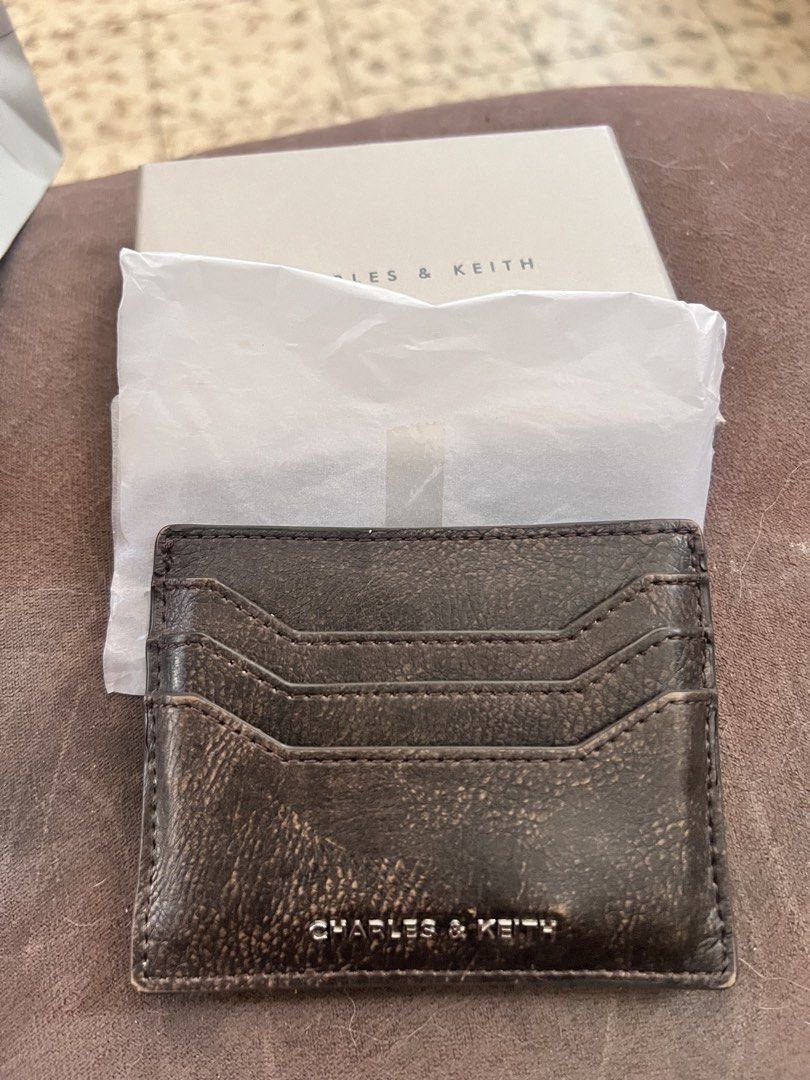 Charles & Keith Carli Cardholder Dark Brown (Category: Wallets & Card holders) located in Manila. Submitted by nicanini (Listing ID 1425875163, Image 1). Description: bought for 1,399php in Singapore - withd old og card box, paper bag (slightly stained) sg exclusive color dark brown slightly negotiable rfs: got a new card holder Loc: Taft, Malate, Manila Mop: maya, gotyme, maribank, bpi, vybe, ub, security bank You can book your own rider or can 