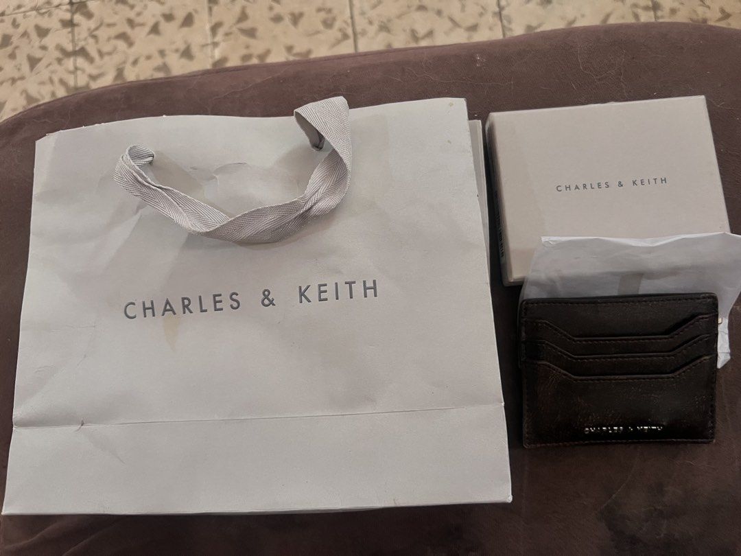 Charles & Keith Carli Cardholder Dark Brown (Category: Wallets & Card holders) located in Manila. Submitted by nicanini (Listing ID 1425875163, Image 3). Description: bought for 1,399php in Singapore - withd old og card box, paper bag (slightly stained) sg exclusive color dark brown slightly negotiable rfs: got a new card holder Loc: Taft, Malate, Manila Mop: maya, gotyme, maribank, bpi, vybe, ub, security bank You can book your own rider or can 