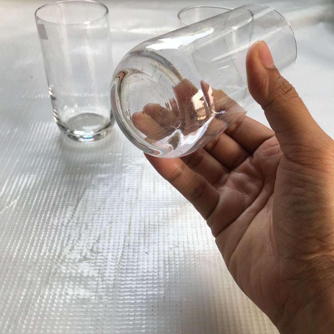 Clear Drinking Glasses Set of 3 #4445 (Category: Other Kitchenware & Tableware) located in Malabon City. Submitted by mldg.surplus (Listing ID 1425877808, Image 3). Description: Set of three clear drinking glasses. These glasses have a simple, cylindrical design with a slightly rounded base. They are suitable for various beverages. The glasses appear to be of a standard size, perfect for everyday use. They are clean and ready to be used. MLDG Sur