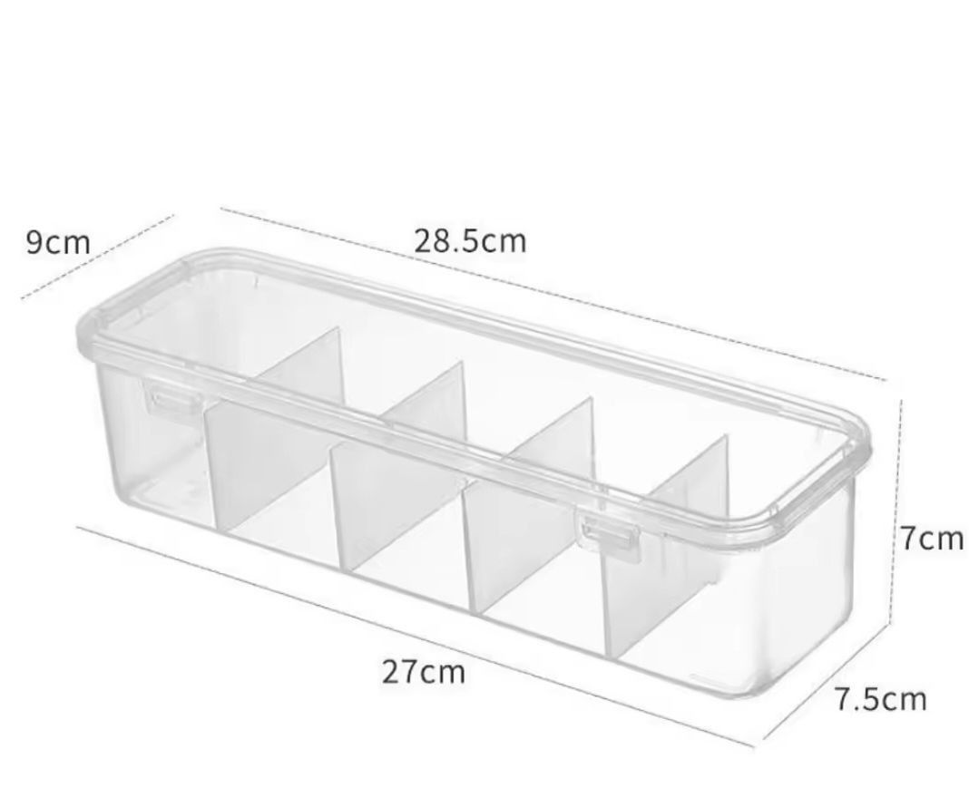 Clear Plastic Storage Box with Dividers - sold each (Category: Storage Boxes & Baskets) located in Quezon City. Submitted by an.marie (Listing ID 1425833152, Image 3). Description: Clear plastic storage box with dividers. The box measures 28.5cm x 7.5cm x 7cm. It has multiple compartments for organizing items. The box comes with a lid. It is suitable for storing various small items. The product is new and comes in its original packaging..