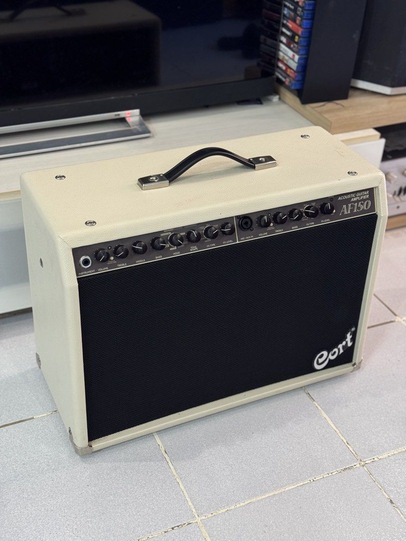 Cort AF150 Acoustic Guitar Amplifier (Category: Soundbars, Speakers & Amplifiers) located in Talisay. Submitted by kim_rey (Listing ID 1425955183, Image 3). Description: The Cort AF150 is a 150-watt RMS acoustic guitar amplifier designed for rich, balanced sound in small venues, featuring dual 8-inch woofers and a tweeter. Key specifications include, 2 * 75W power output, 4-band graphic EQ, built-in DSP (chorus/delay), and a notch filter for feed