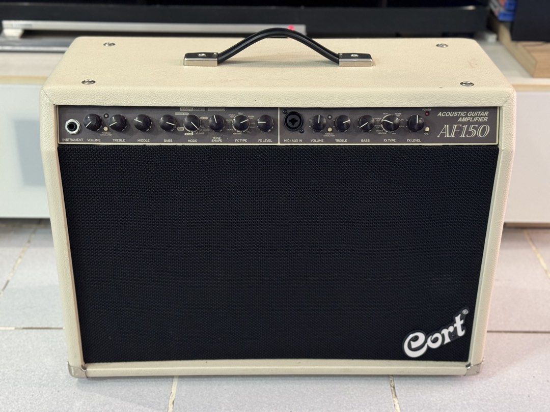 Cort AF150 Acoustic Guitar Amplifier (Category: Soundbars, Speakers & Amplifiers) located in Talisay. Submitted by kim_rey (Listing ID 1425955183, Image 1). Description: The Cort AF150 is a 150-watt RMS acoustic guitar amplifier designed for rich, balanced sound in small venues, featuring dual 8-inch woofers and a tweeter. Key specifications include, 2 * 75W power output, 4-band graphic EQ, built-in DSP (chorus/delay), and a notch filter for feed