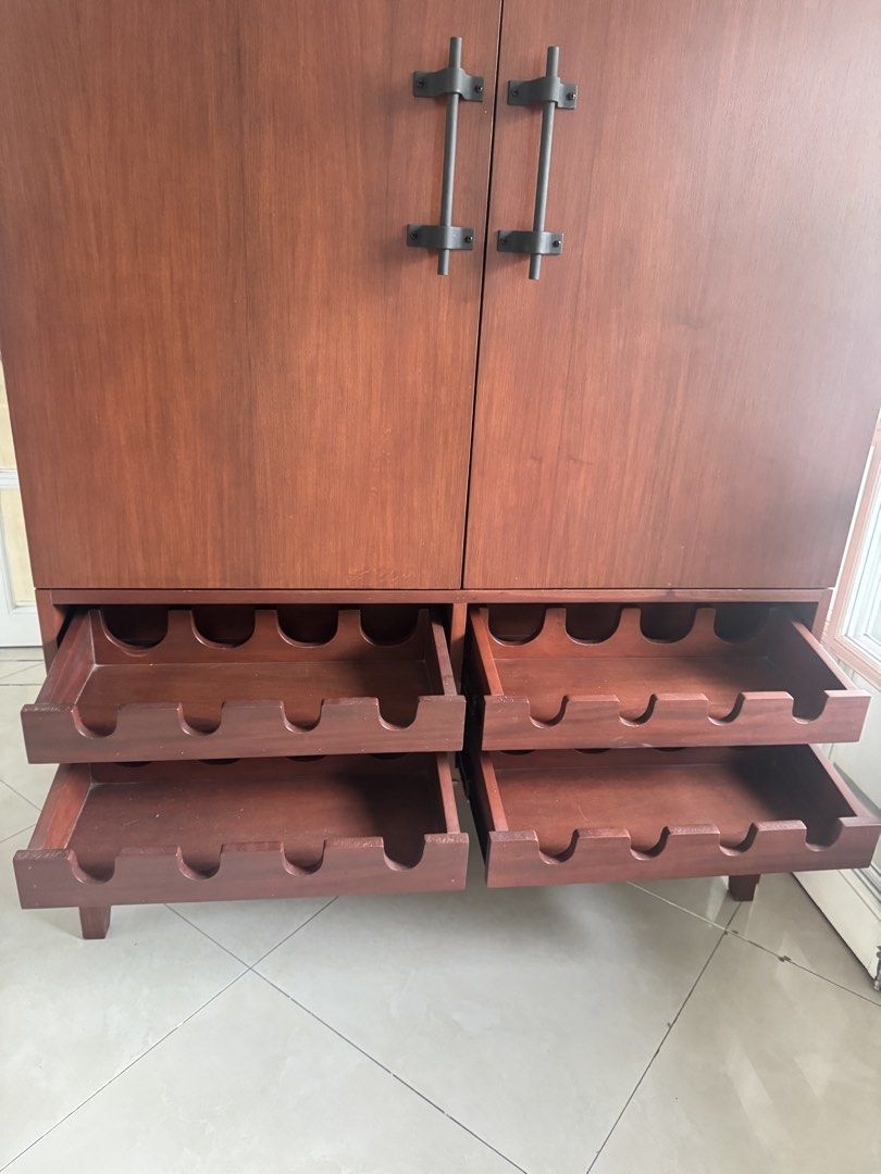 Designer Vintage Solid Wood Home Bar Cabinet with Wine & Glass Storage Statement piece (Category: Shelves, Cabinets & Racks) located in Muntinlupa City. Submitted by boo_thingthings (Listing ID 1425822530, Image 2). Description: • Solid wood statement bar cabinet • Built-in wine bottle storage and hanging stemware rack • Interior mirrored bar for classic cocktail presentation • Warm hand-finished wood tone with matte black hardware • Elegant prop
