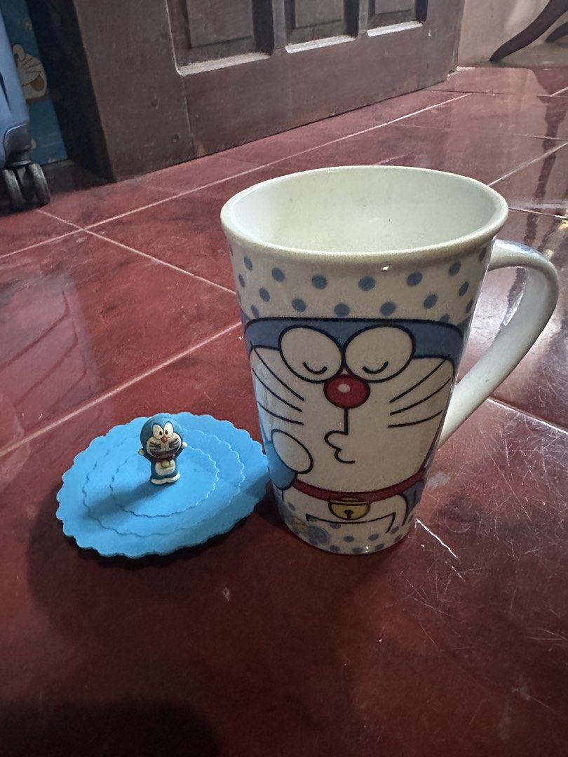 Doraemon Mug with Lid (Category: Coffee & Tea Tableware) located in Taguig. Submitted by seek_and_ship (Listing ID 1425923513, Image 1). Description: .