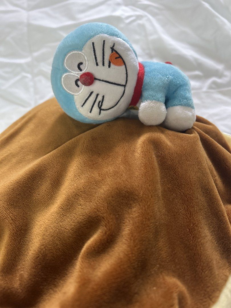 Doraemon Plush Toys and Pinball Game (Category: Plushies & Soft Toys) located in Bulacan. Submitted by ourdailybreads (Listing ID 1425874154, Image 2). Description: Listing includes two Doraemon plush toys and a Doraemon pinball game. One plush toy is a large Doraemon, and the other is a smaller one. The pinball game features Doraemon and other characters. The items are perfect for Doraemon fans and collectors..