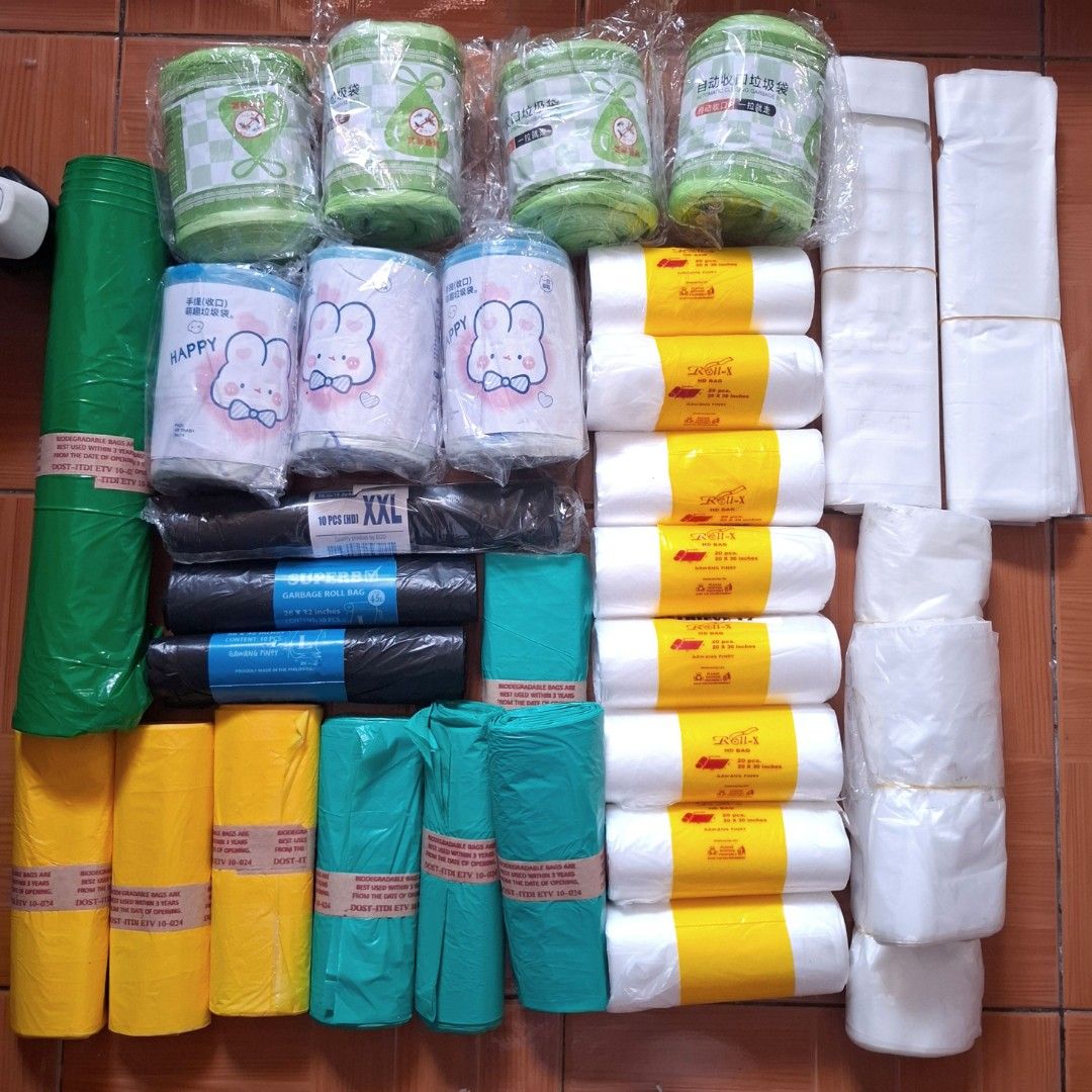 Garbage Bags - TAKE ALL (Category: Waste Bins & Bags) located in Quezon City. Submitted by an.marie (Listing ID 1425821994, Image 1). Description: Variety pack of trash bags in different sizes and colors. Includes white, green, yellow, and black bags. Some bags are in rolls, while others are folded. Sizes appear to range from small to XXL. Perfect for home or office use..