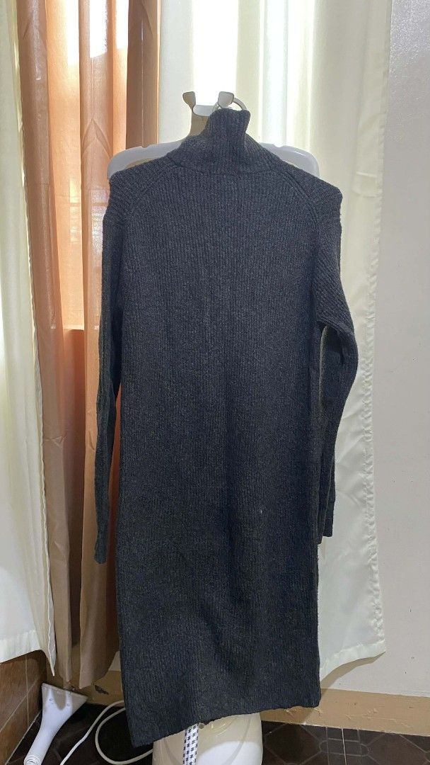Gray Turtleneck Dress (Category: Dresses) located in Manila. Submitted by eafinance559493 (Listing ID 1425869528, Image 1). Description: Gray, long-sleeved dress with a turtleneck. The dress is a midi length. It is displayed on a clothing steamer..
