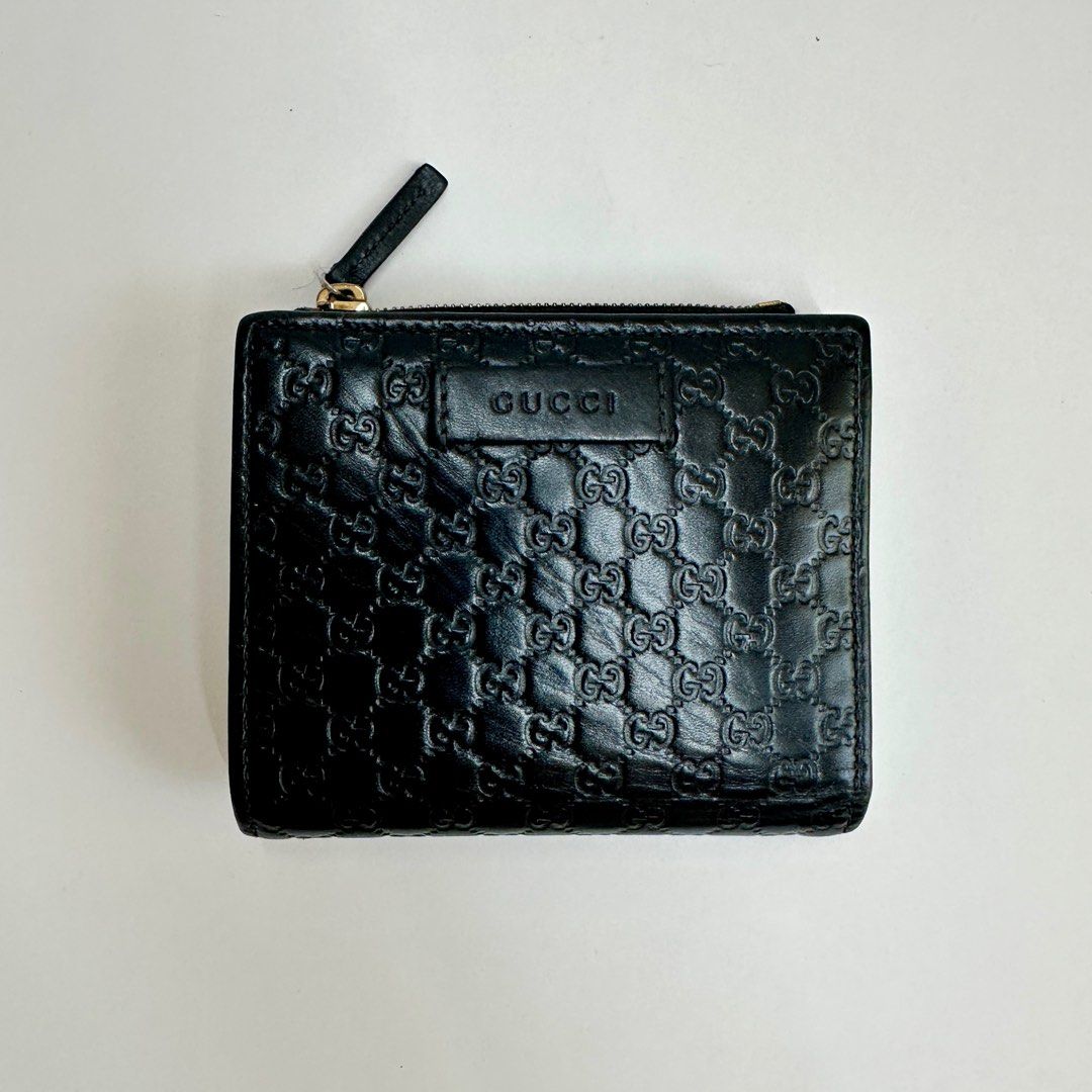 Gucci Microguccissima Bifold Wallet (Category: Luxury Bags & Wallets) located in Cebu City. Submitted by rayndeer_28 (Listing ID 1425934443, Image 2). Description: Gucci Microguccissima Bifold Wallet Black Leather FEATURES: Slip Pocket for Bills Zipped Coin Compartment 6 Card Slots 2 Slip Pockets INCLUSIONS: Box Dustbag (restitched logo as it once fell apart) Care Cards 2 Gucci Silica Gel Packets See photos for details. All sales final, Shipping 
