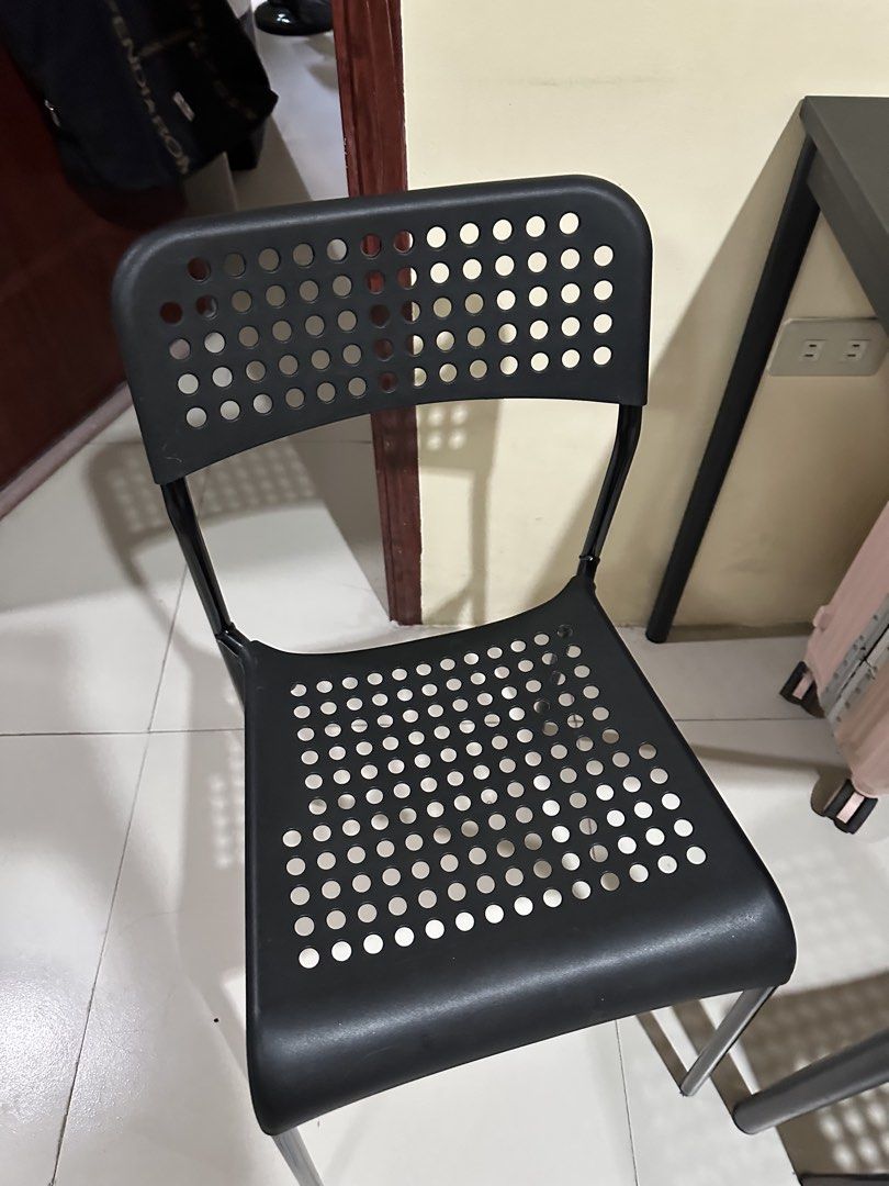 IKEA SANDSBERG Table and Chairs Set (Category: Tables & Sets) located in Manila. Submitted by itsyourgirlmc (Listing ID 1425860935, Image 3). Description: - Location: Tarlac! - Ikea SANDSBERG dining set - Black rectangular table with metal frame (approx. 110x67 cm) - Includes four black chairs - Chairs feature perforated seat and backrest - Ideal for small dining areas or kitchens Moving out sale 🥺.