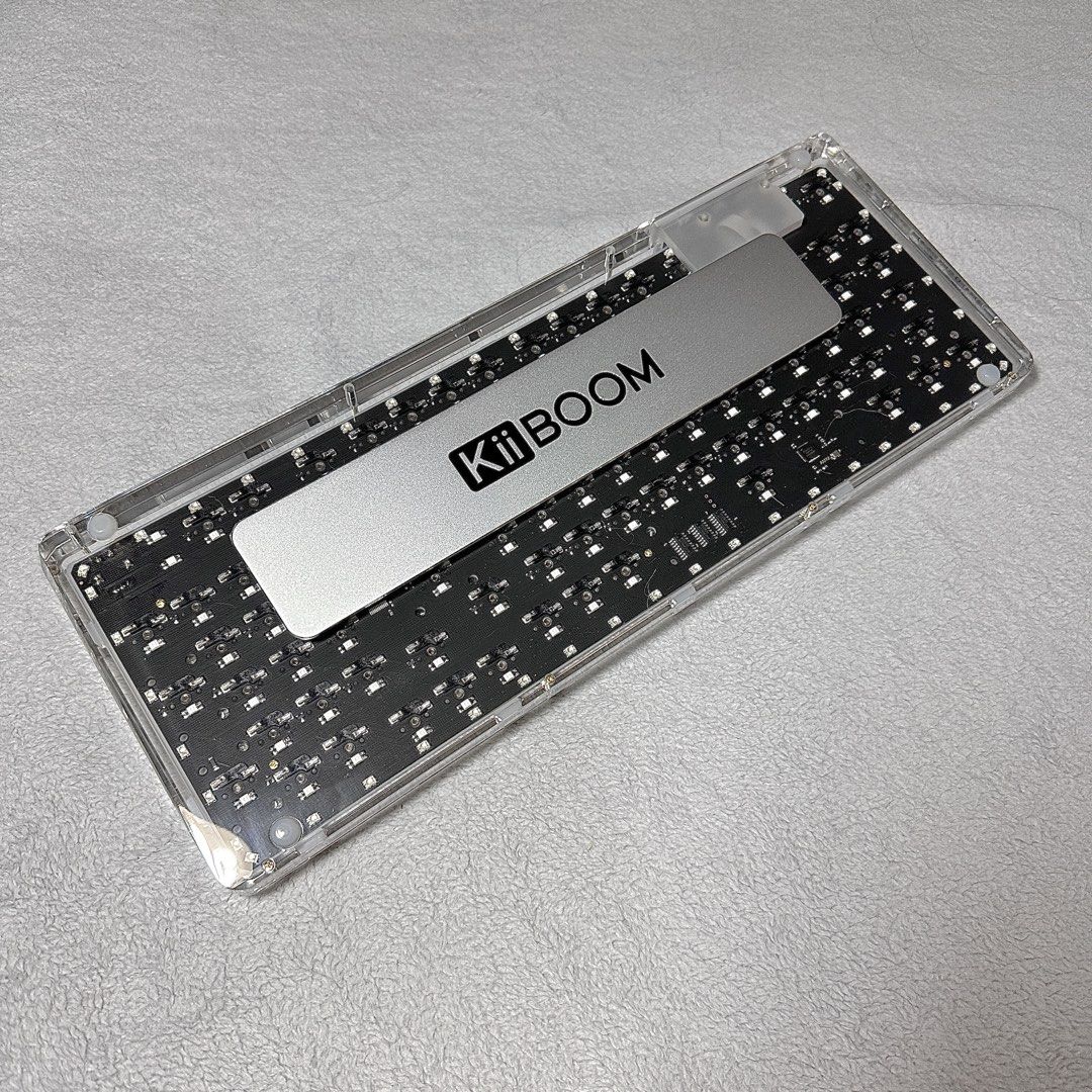 KiiBOOM Phantom 98 Crystal Keyboard (Category: Computer Keyboard) located in Paranaque City. Submitted by hershey_august (Listing ID 1425957127, Image 3). Description: 98-Key Compact Layout – Full functionality with number pad in a space-saving design. Transparent Acrylic Case – Sleek crystal-clear build that enhances RGB lighting. Hot-Swappable Switches – Easily customize switches without soldering. Triple-Mode Connectivity – Bluetooth, 2.4GHz w