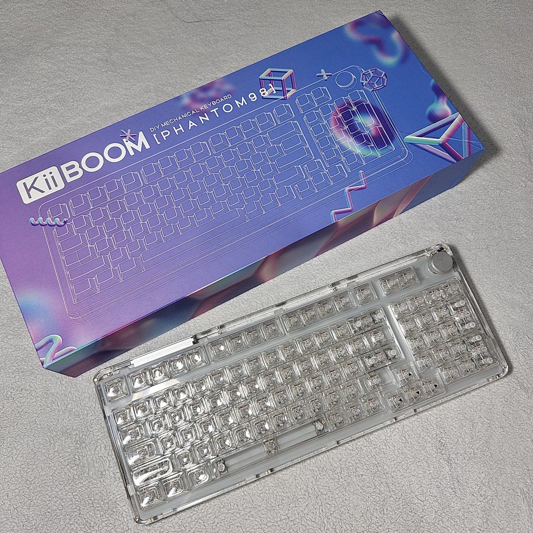 KiiBOOM Phantom 98 Crystal Keyboard (Category: Computer Keyboard) located in Paranaque City. Submitted by hershey_august (Listing ID 1425957127, Image 1). Description: 98-Key Compact Layout – Full functionality with number pad in a space-saving design. Transparent Acrylic Case – Sleek crystal-clear build that enhances RGB lighting. Hot-Swappable Switches – Easily customize switches without soldering. Triple-Mode Connectivity – Bluetooth, 2.4GHz w