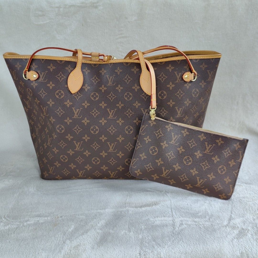 Louis Vuitton Neverfull MM (HQR) (Category: Luxury Bags & Wallets) located in Barotac Nuevo. Submitted by yorcollections (Listing ID 1425853060, Image 2). Description: HQR Louis Vuitton Neverfull MM tote bag. Features the iconic Monogram canvas. Includes a matching pouch. The interior has a striped lining with a zipped pocket. LOUIS VUITTON (HQR only) Neverfull MM Monogram with pouch RFS brand new bought 400 dirhams from Dubai for my mom kaso di 