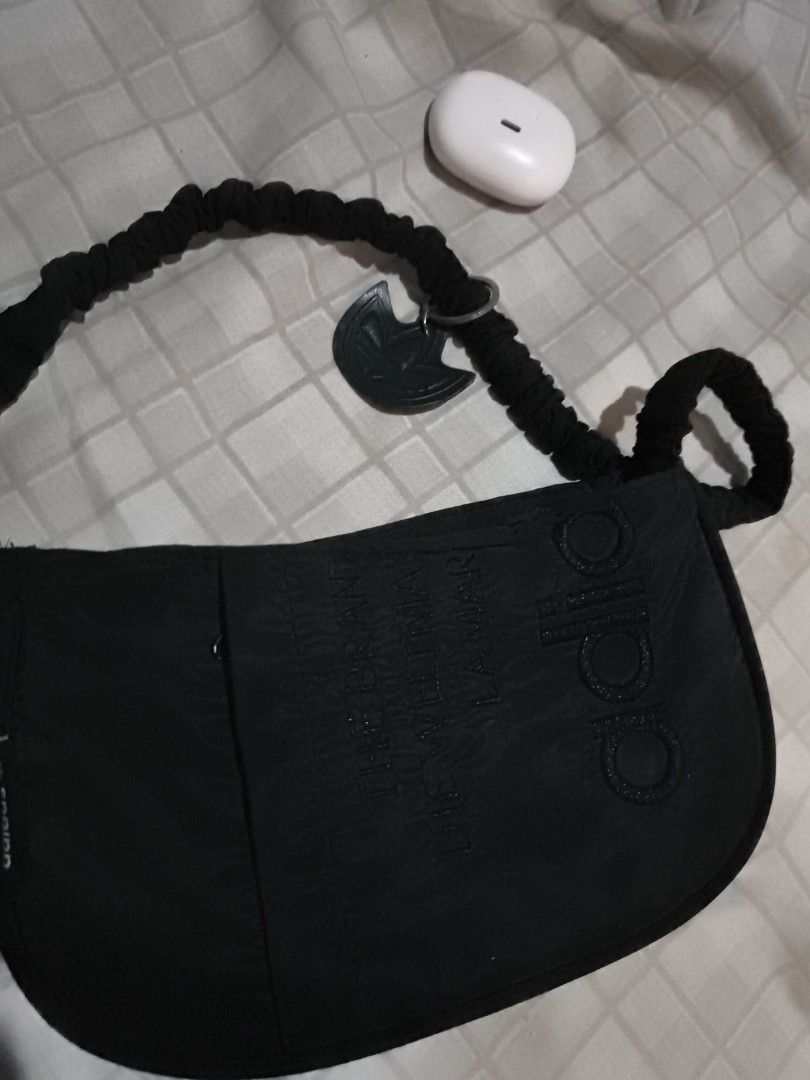 Original Adidas Black Kili Bag (Category: Shoulder Bags) located in Manila. Submitted by kitty.ribbon (Listing ID 1425998229, Image 1). Description: Black Adidas shoulder bag. Features a braided strap and a small Adidas logo charm. The bag has the Adidas logo embossed on the front. The bag has a curved shape..