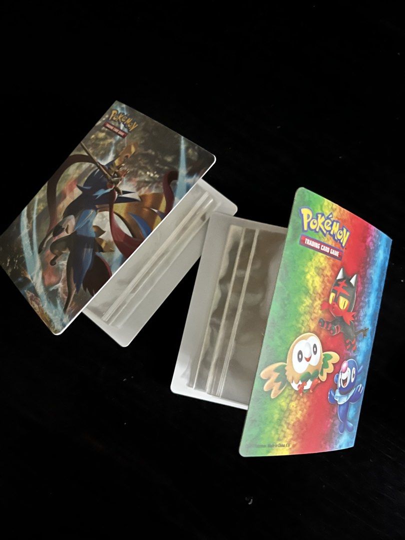 Pokemon Card Binder and Sleeves (Category: Trading Cards Accessories) located in Manila. Submitted by sunshineapril (Listing ID 1426001245, Image 3). Description: Listing includes two mini Pokemon Trading Card Game binders and 20 card sleeves. The binders feature artwork of Zacian, Zamazenta, and other Pokemon characters. The sleeves have various designs, including a Pikachu design. Perfect for organizing and protecting your Pokemon cards..