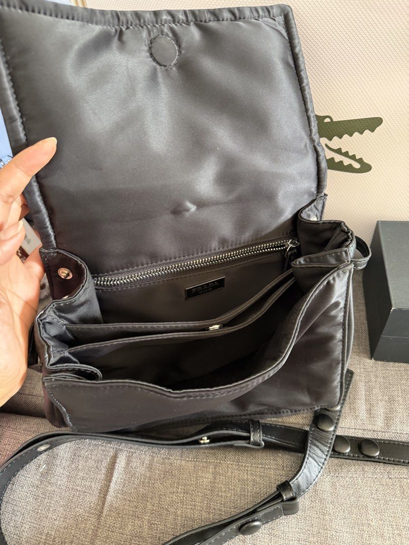 Prada Black Nylon Crossbody Bag (Category: Luxury Bags & Wallets) located in Quezon City. Submitted by egptasiaco (Listing ID 1425848849, Image 3). Description: Prada nylon bought from japan With 8 compartments.