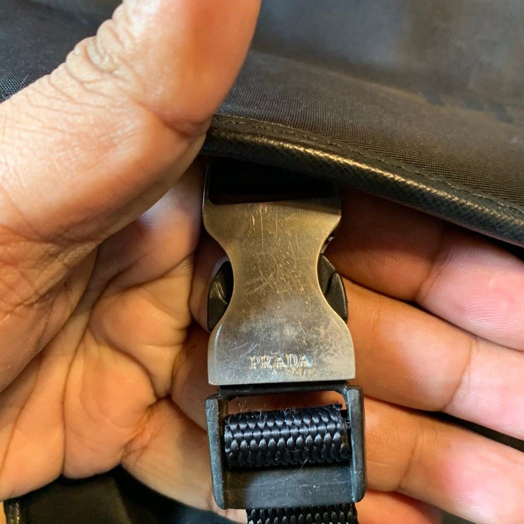 Prada Messenger Bag (Category: Luxury Bags & Wallets) located in Carmen. Submitted by ar_thrift00 (Listing ID 1425918295, Image 2). Description: lampo and ykk zip no white tag as is sign of used.