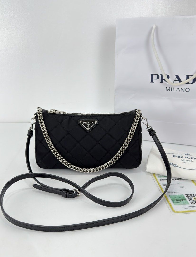 Prada Tessuto Impuntu Quilted Nylon (Category: Luxury Bags & Wallets) located in Manila. Submitted by luxuryprelovedbagsby_by_agnes (Listing ID 1425968771, Image 1). Description: Excellent Condition RFID Version Perfect size / Simple Goes with everything Dimensions: W 23cm x H 13cm x D 7 cm.