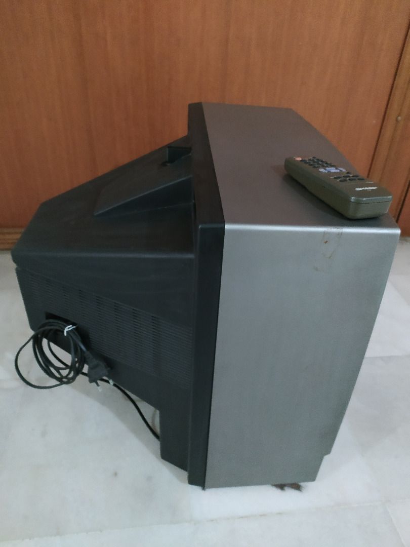 Sharp Solid State TV 21" w/ Remote (Category: TV) located in Puchong. Submitted by optimusone (Listing ID 1425891349, Image 3). Description: Brand: Sharp. Model: 21A1-A Original vintage with serial number Solid State Colour Television 21-inch Remote control No scratch/burn pixel on CRT screen No Google/Android OS ads Fault: Press "On" few times to start Most likely Power Supply capacitor dry out Condition: Used and Defective Market value RM150 se